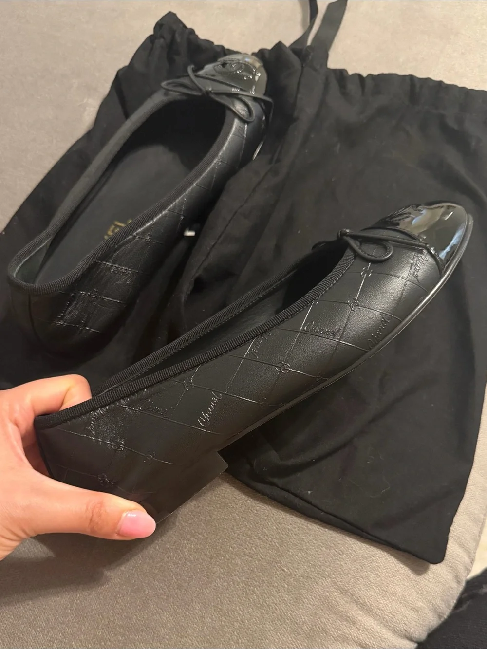 CHANEL Black Quilted Leather Cap-Toe Bow Ballet Flats